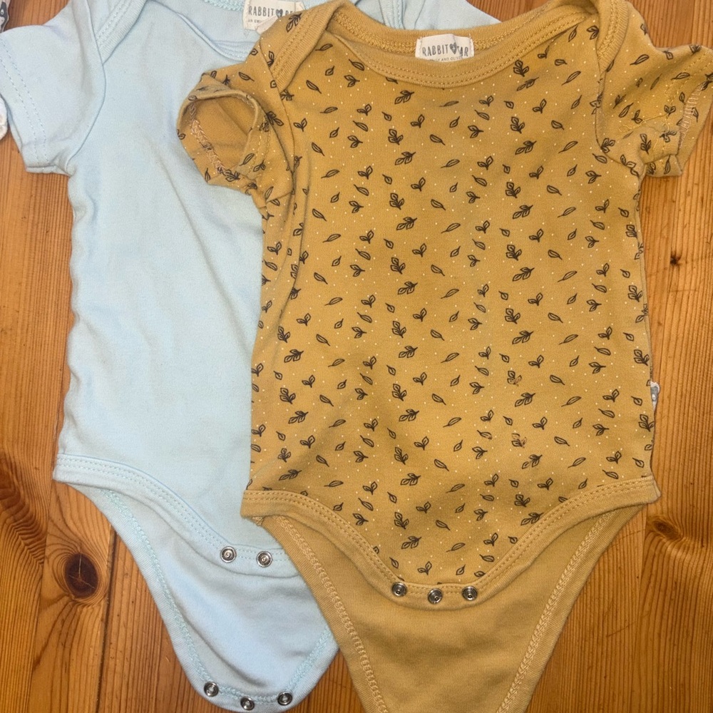 Rabbit and Bear organic onesies baby blue and mustard yellow leaf print
